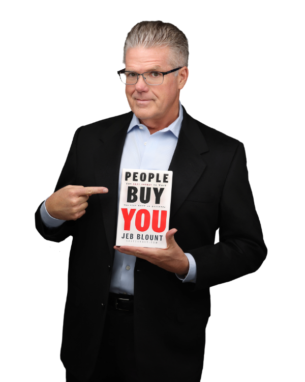 Bart Ratliff, Founder of Client Growth Strategies, holding People Buy You by Jeb Blount