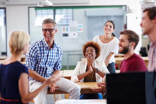 small business team in a group huddle happy and focused on working on their business while their IT managed by Don's Tech Rescue in Pittsburgh
