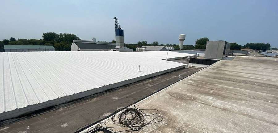 Low-slope roof of The Marketplace grocery store in Cokato, MN during a July 2023 Repair King inspection