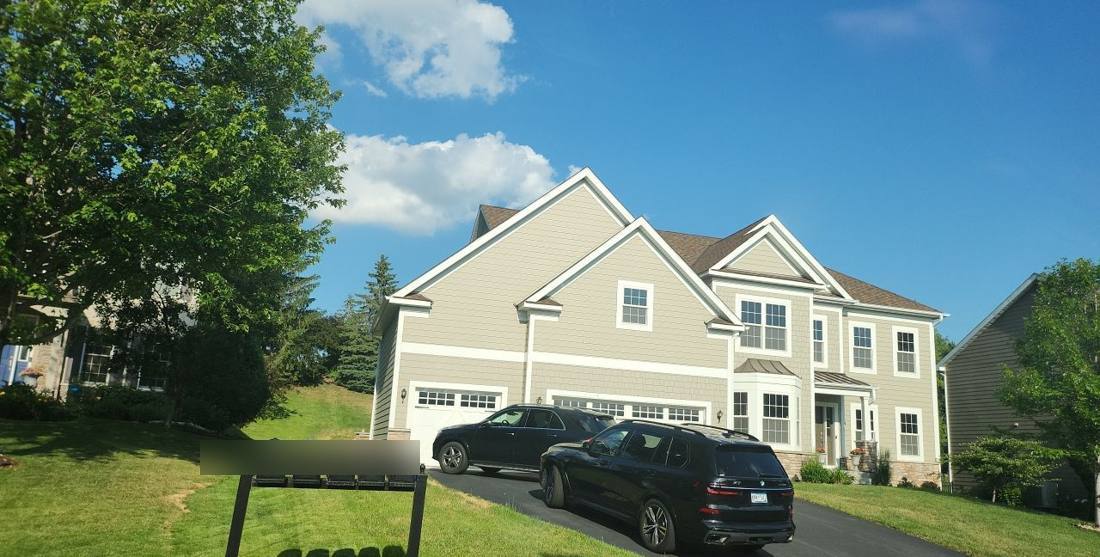 Two-story Eagan home photographed during a roof inspection, June 2023