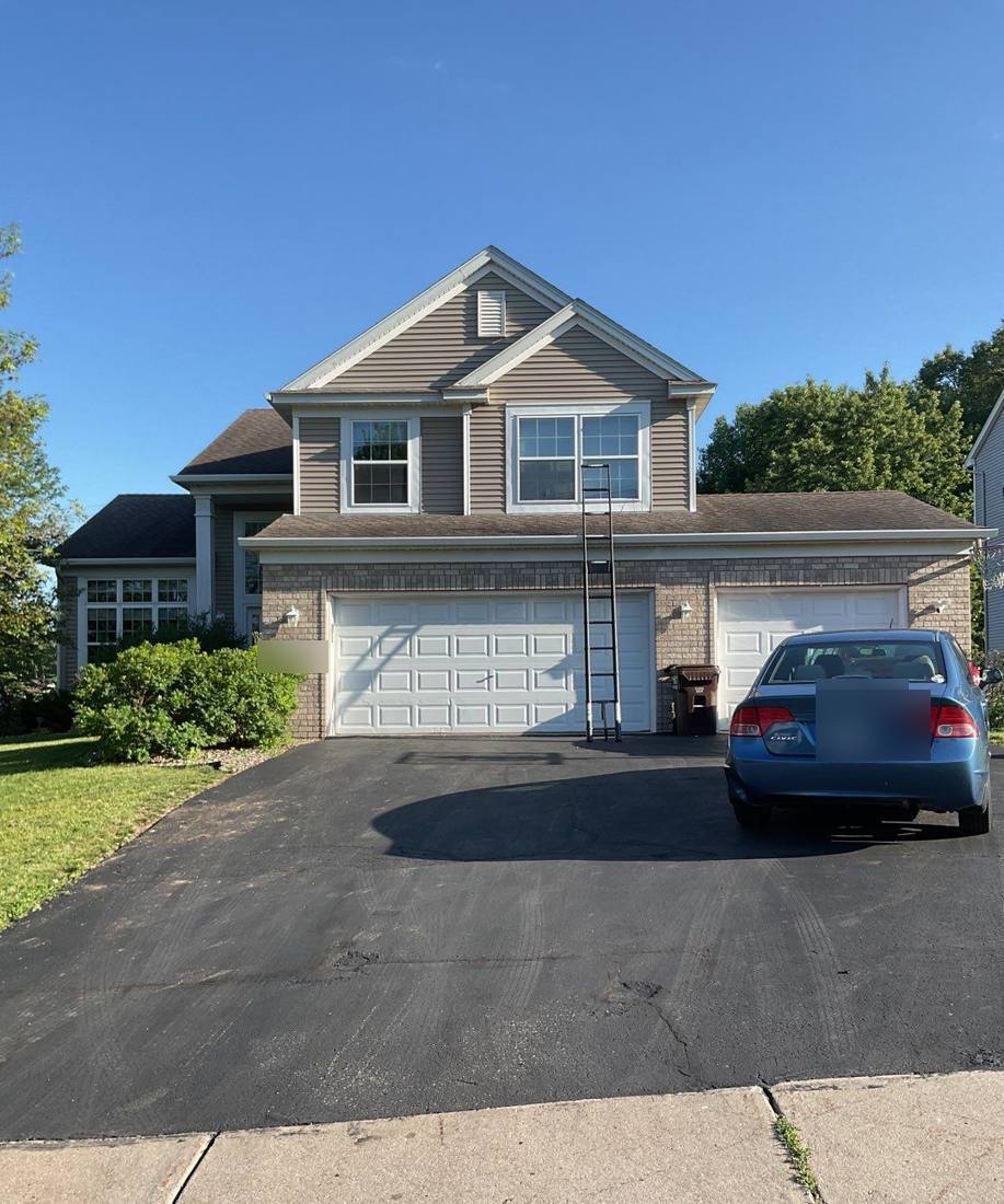 Two-story Cottage Grove home during a roof inspection, July 2023