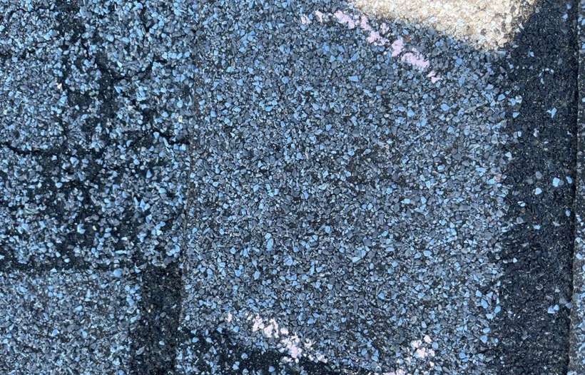 A chalk-circled hail hit on a Culver's shingle in Waite Park, September 2021