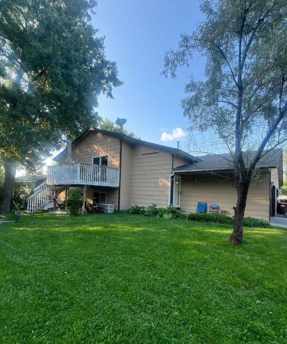 Split-level Oakdale home with a walkout deck, photographed during a July 2024 project
