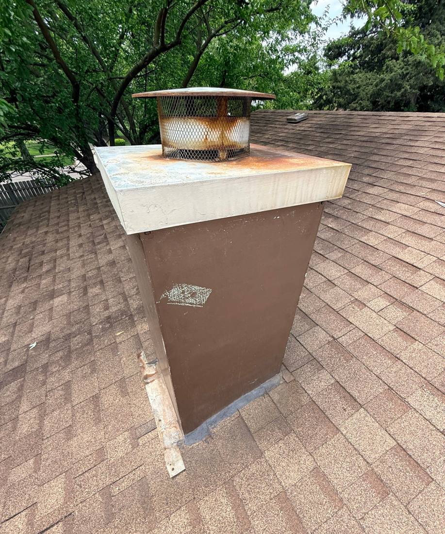 Rusted chimney flashing found on a Darien roof, April 2026