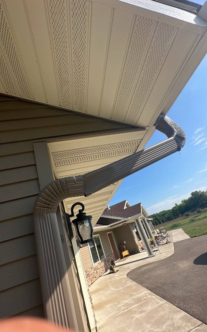 Soffit and gutter downspout detail on a Clearwater-area home, July 2023