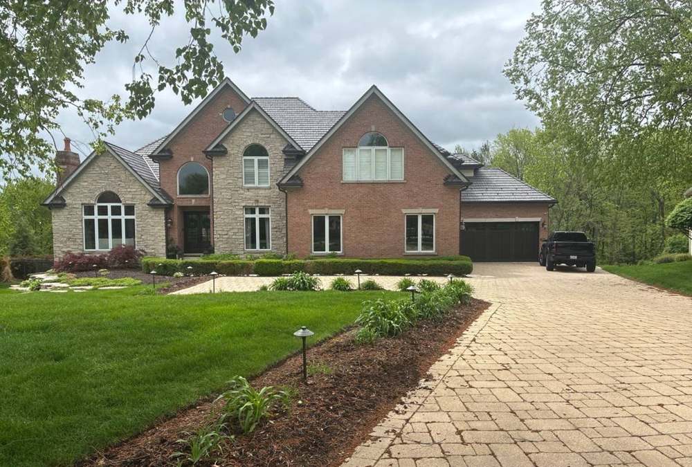 Two-story home photographed during a Shorewood roof project, May 2026