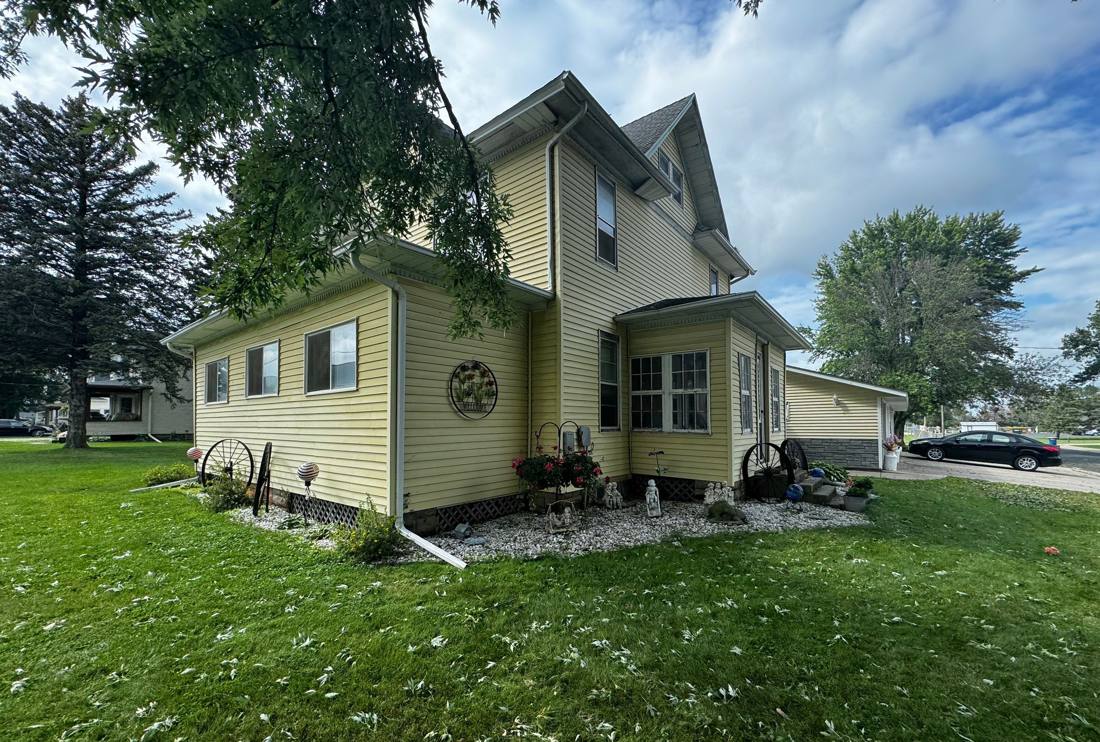 Two-story home near downtown Goodhue photographed during a roof inspection, August 2024