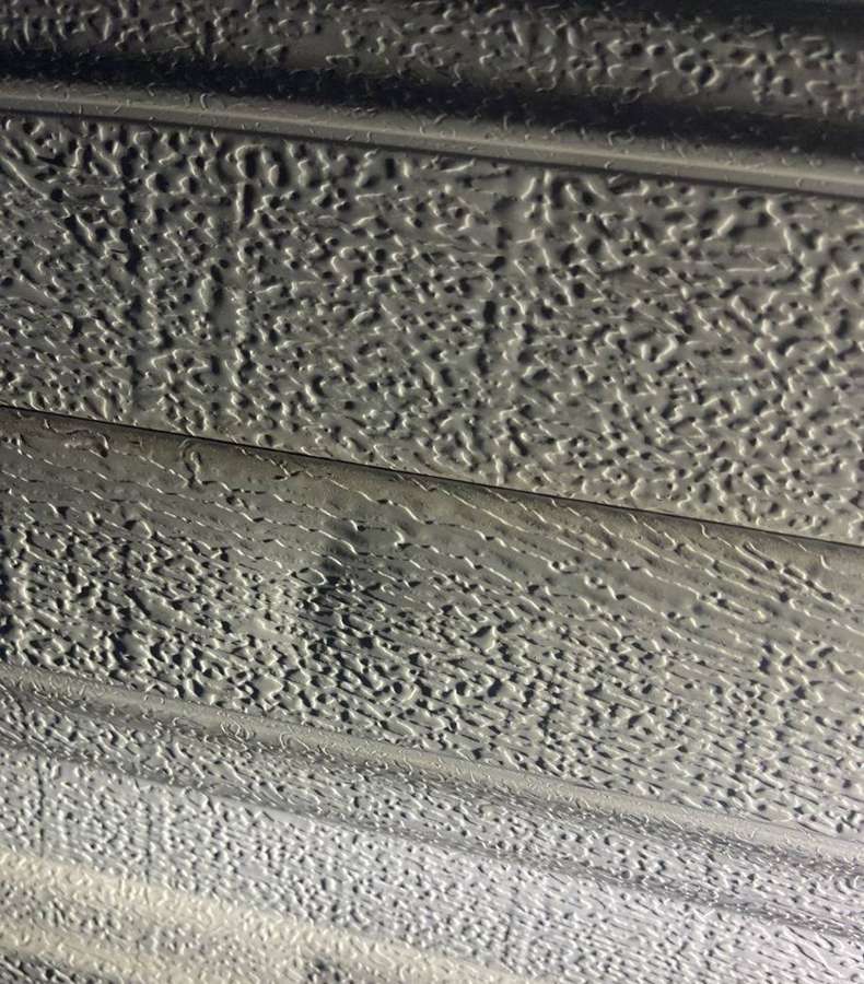 Dented garage door panel found on a Buffalo storm inspection, October 2021