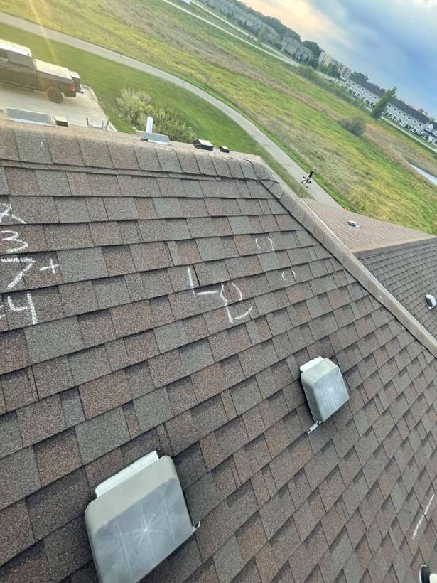 Chalk-marked shingle roof of a Pinecone Villas townhome in Sartell, MN, near St. Joseph, during a September 2021 Repair King hail inspection
