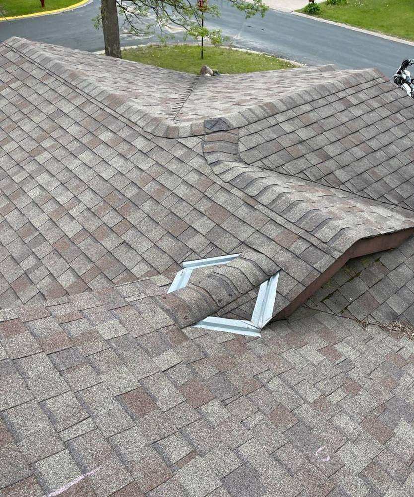 Roof valley and diverter flashing found during a Zimmerman inspection, May 2022