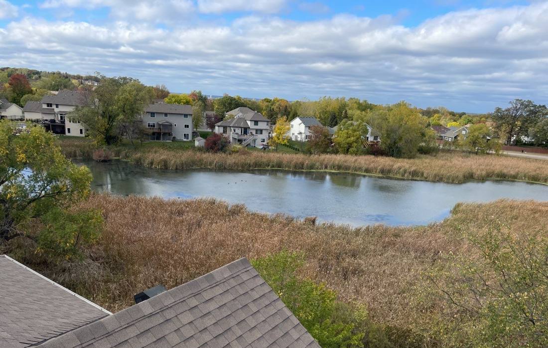 View from a Savage rooftop over a neighborhood pond, October 2021