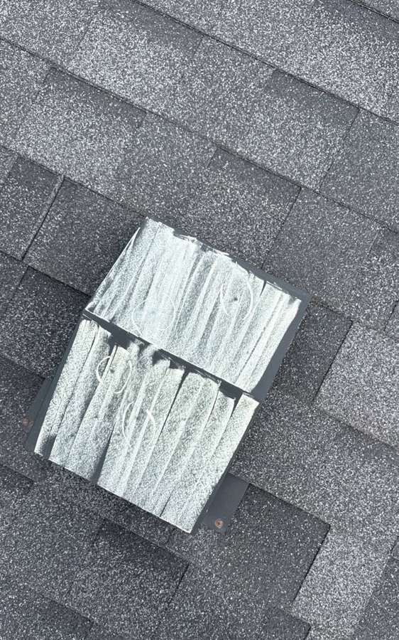 Chalk-marked metal box vent on the Valley View Assembly of God roof in Lake City, April 2026
