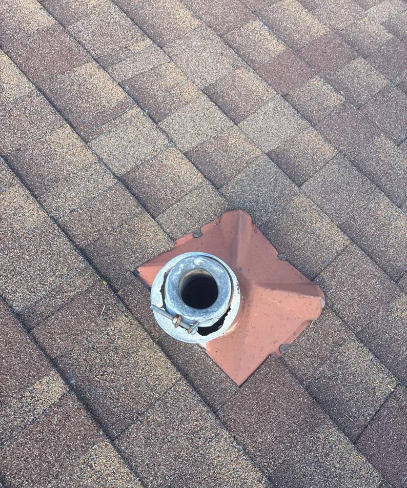 Metal roof vent boot inspected on a Fridley roof, June 2026