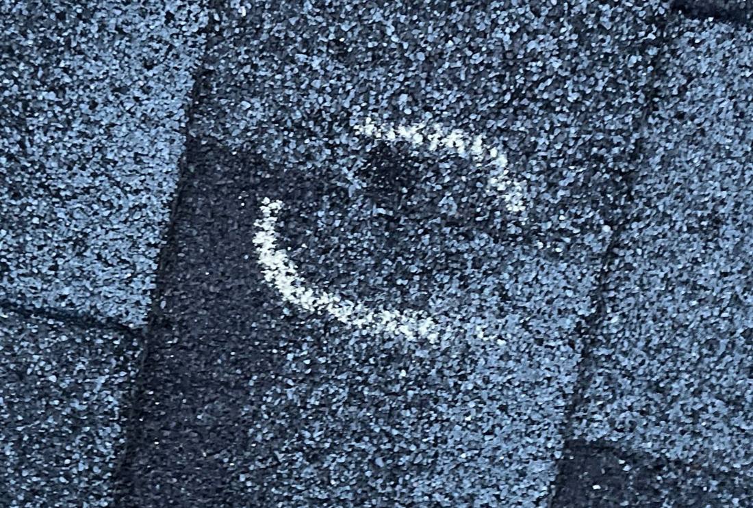 Hail hits chalk-marked on a Woodbury roof slope during an inspection, March 2024