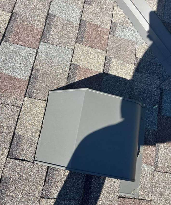 New roof vent flashing going in during a Chisago City re-roof, June 2026