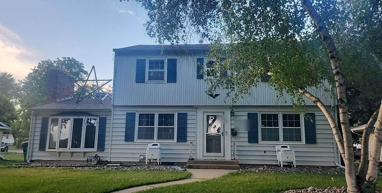 Two-story home on Fir Avenue NE in Montgomery, MN, photographed by Repair King during a 2023 roof inspection