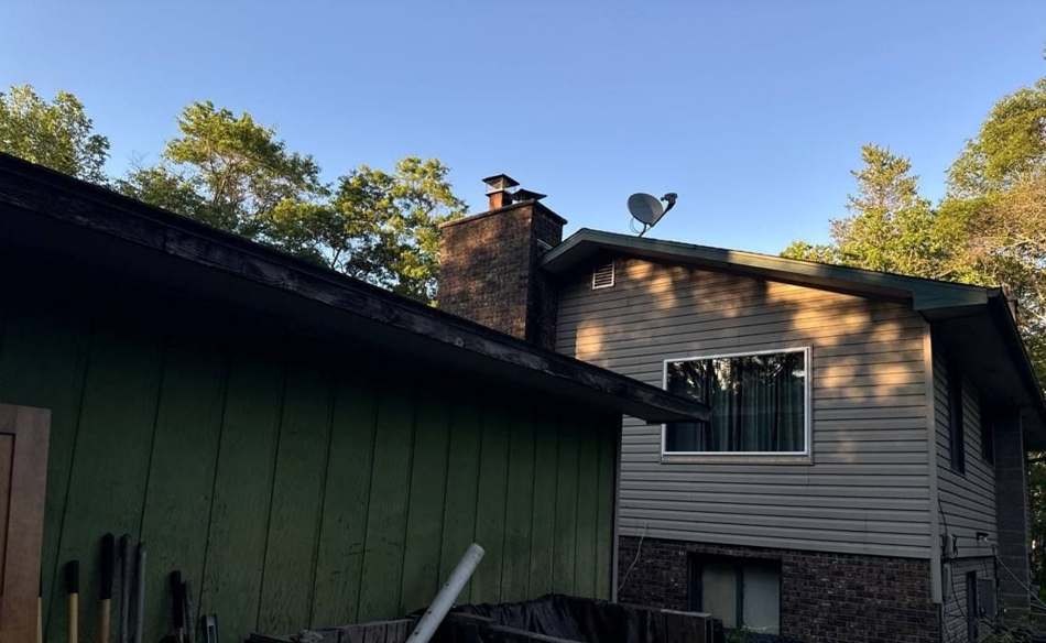 Hail hit chalk-marked on a Crosslake roof slope during an inspection, June 2024