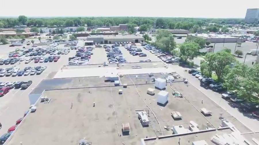 Drone view across the flat roof and rooftop units of the Bloomington Lincoln dealership at 7800 Dupont Ave S in Bloomington, MN