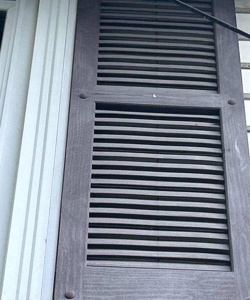 Louvered shutter vent checked during a Newport inspection, September 2025