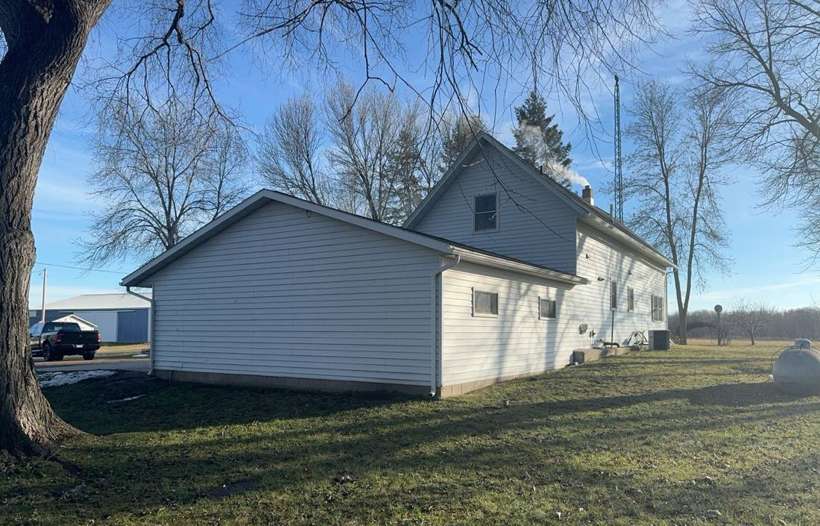 The farmhouse and garage from the side yard, near Little Falls, January 2024