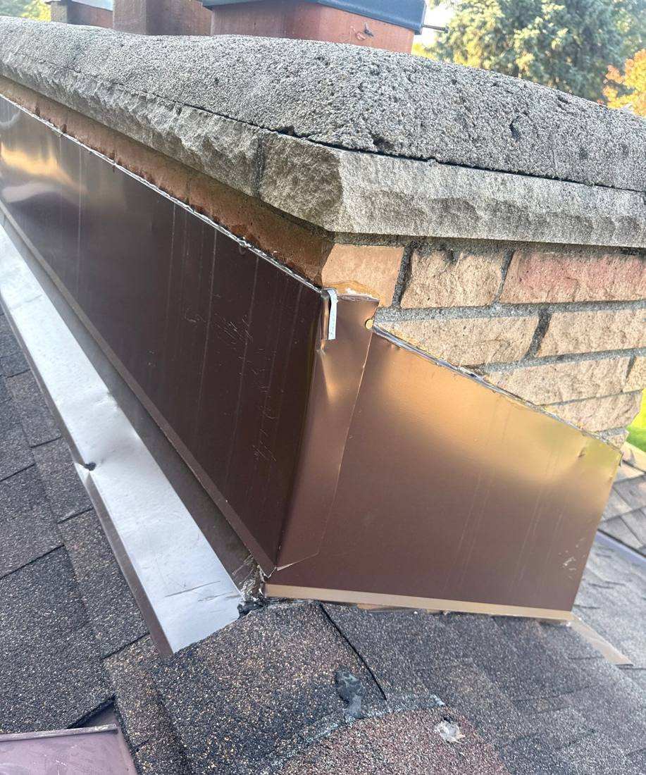 New copper-style chimney flashing on a Roseville roof, October 2025