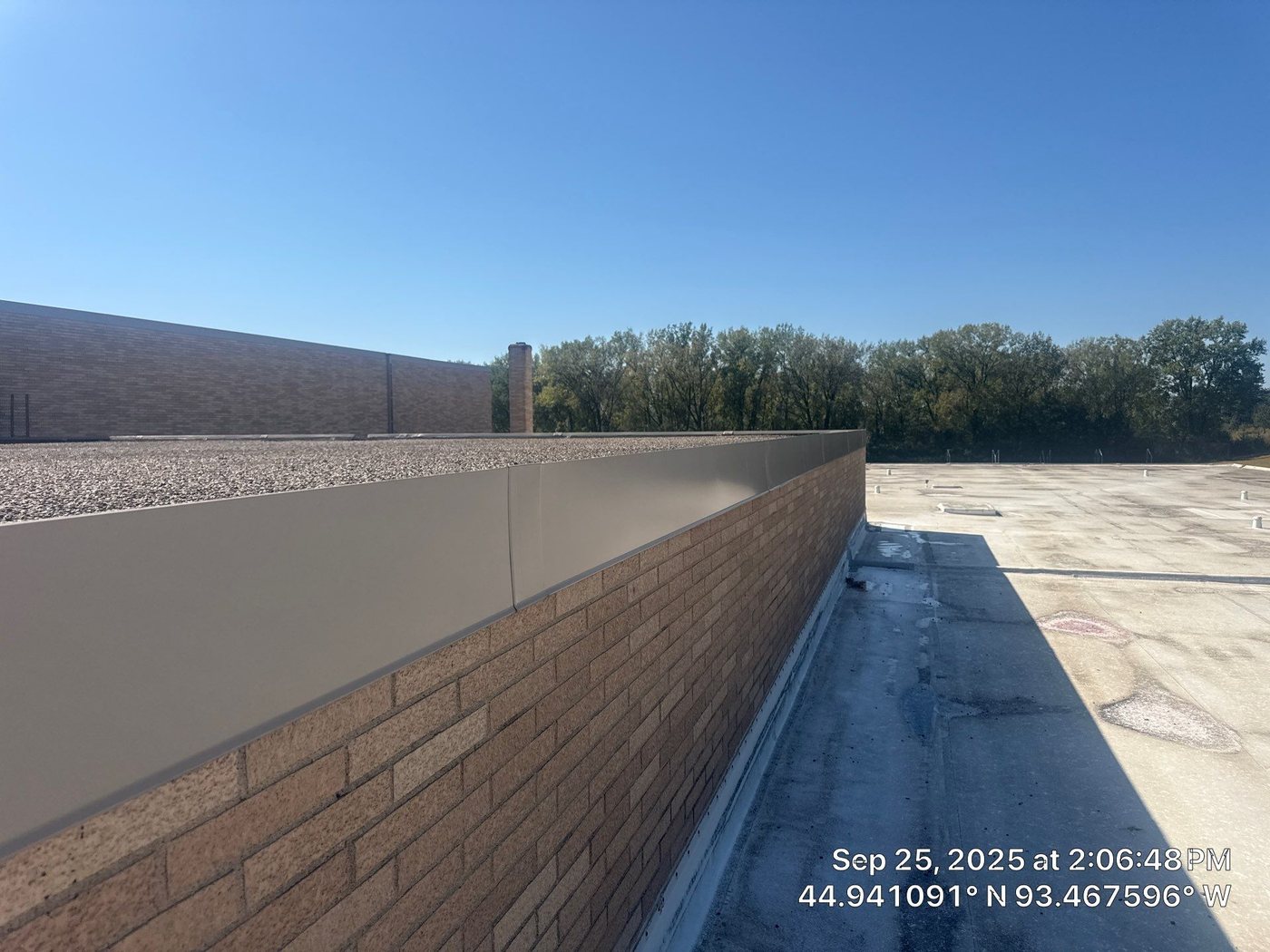 Metal coping along the brick parapet at Minnetonka Christian Academy, September 2025