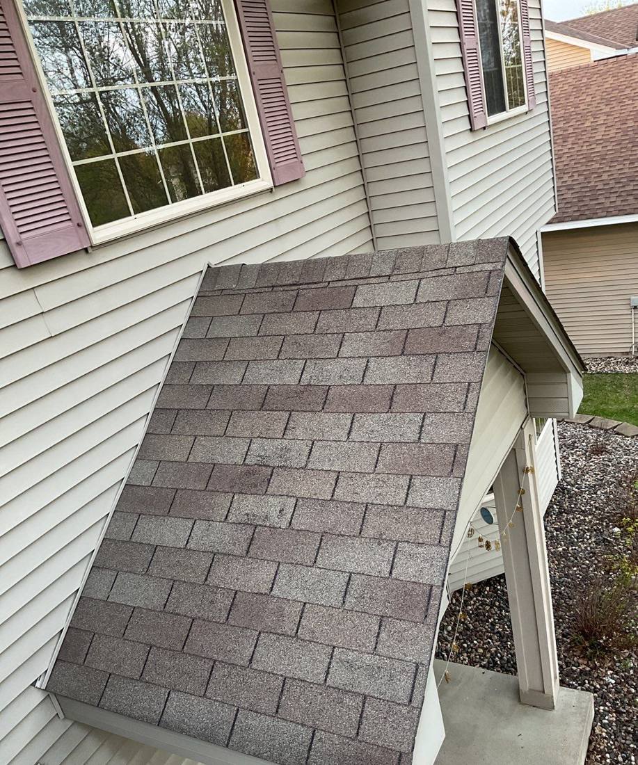 Gutter, downspout and dormer detail on a Savage roof, May 2023