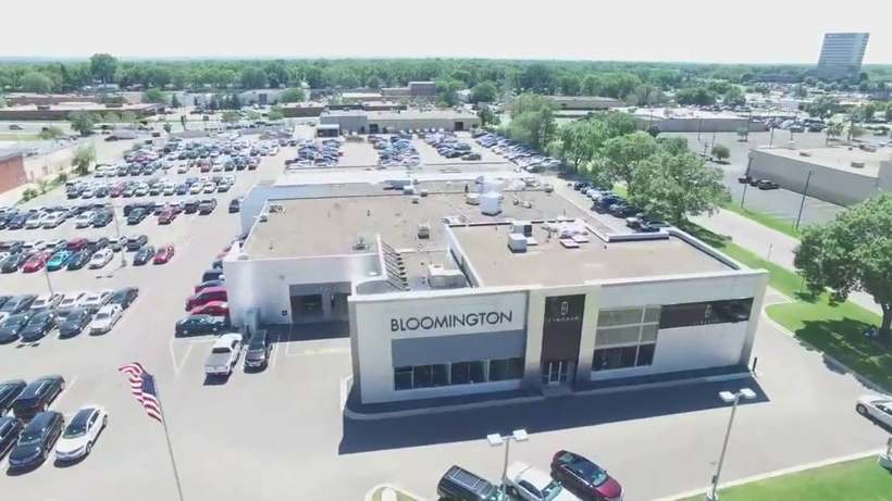 Drone view of the Bloomington Lincoln dealership showroom and flat roof at 7800 Dupont Ave S in Bloomington, MN