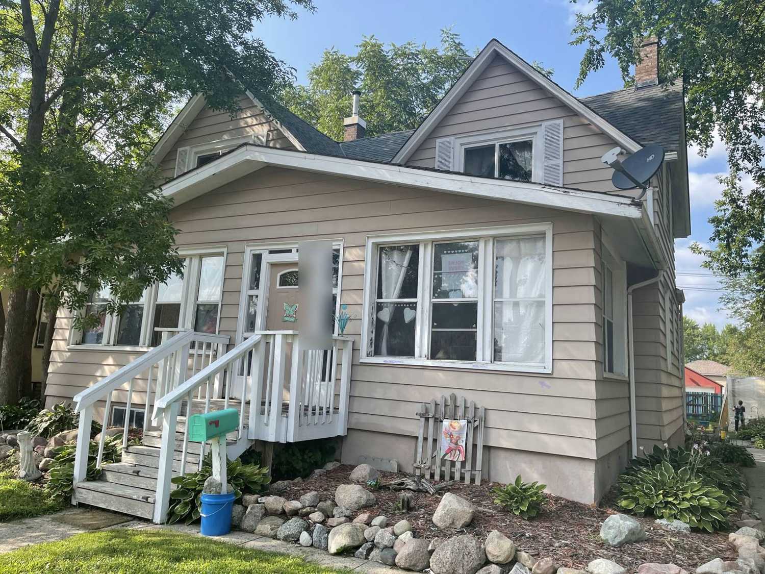Story-and-a-half home with lap siding and a front stoop in New Prague, MN, photographed by Repair King during an August 2021 storm inspection