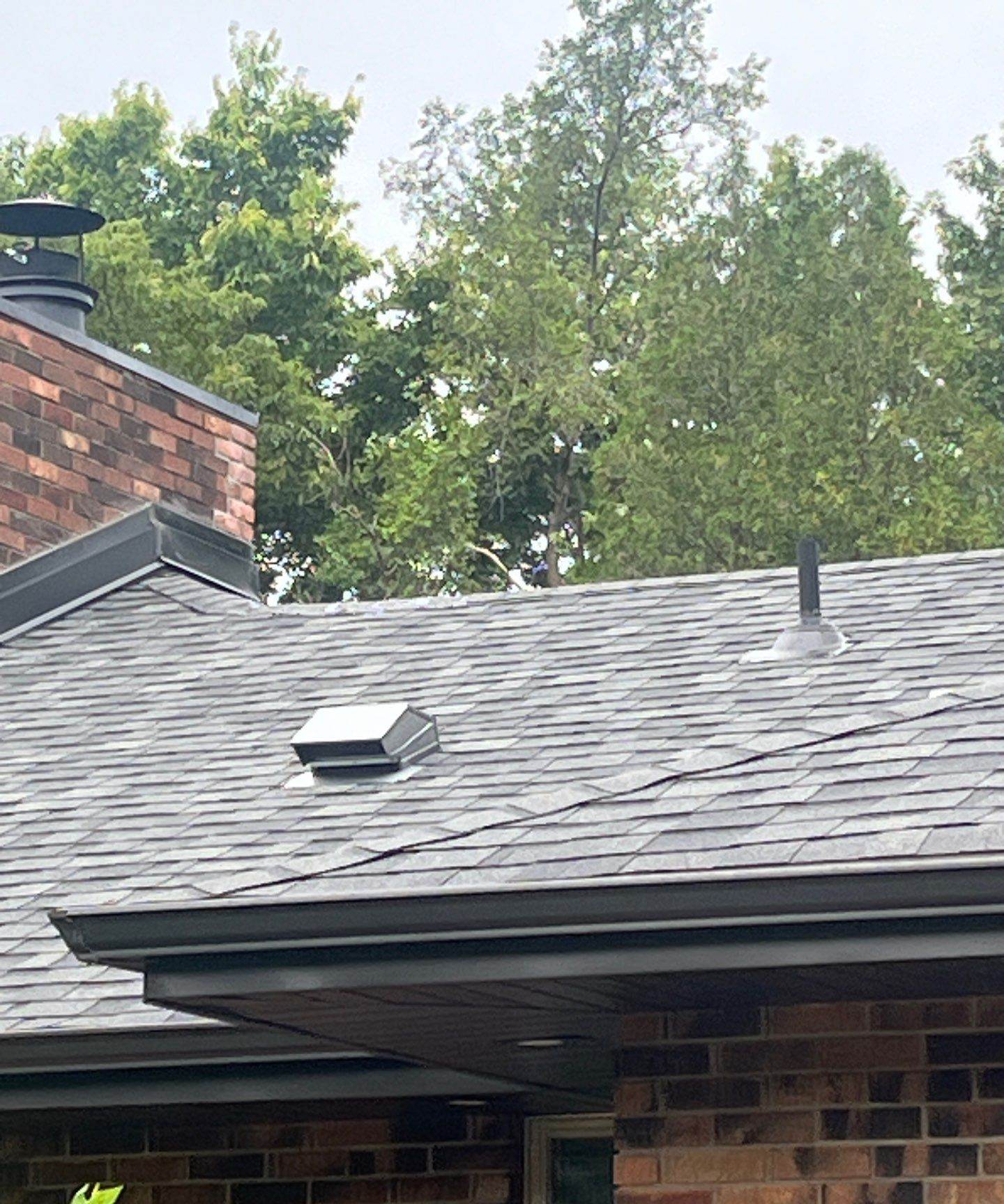 Chimney and roofline of a Mendota Heights home photographed by Repair King during an August 2024 inspection