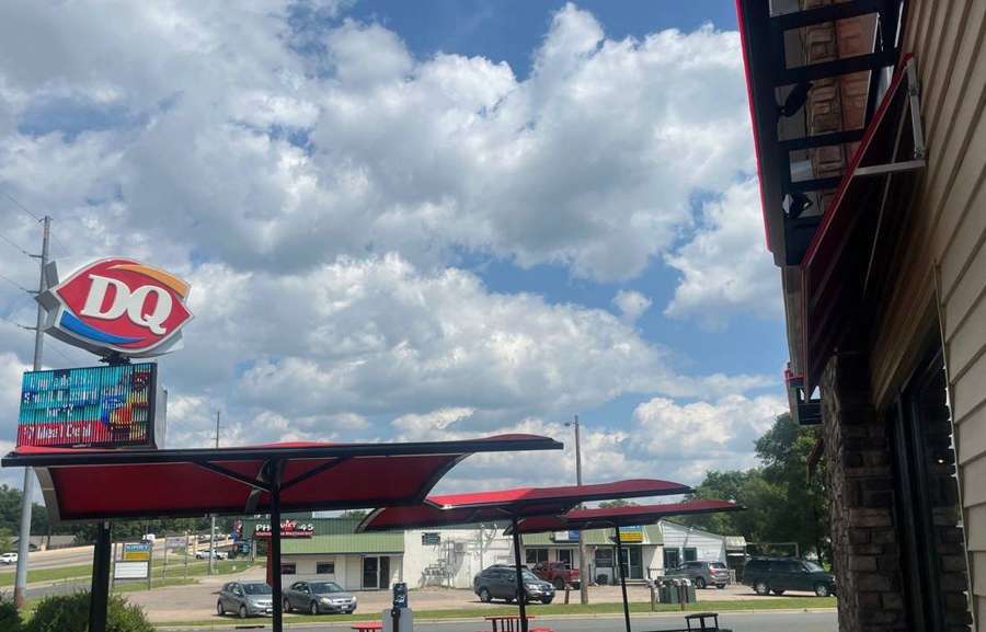 Dairy Queen sign and patio umbrellas in Delano during a July 2024 visit