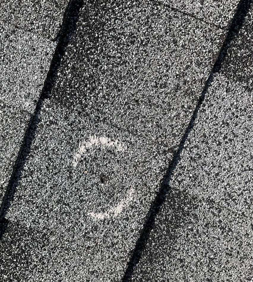 Chalk-circled hail hit on a Blaine roof, July 2023