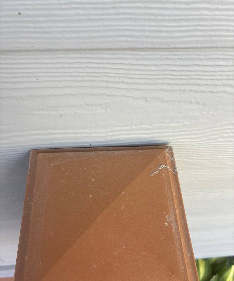 Dented plastic roof vent cap found on a New Brighton inspection, June 2026