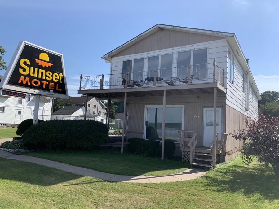 Sunset Motel in Lake City, MN, with its roadside sign and two-story tan building, photographed by Repair King during the pre-sale inspection