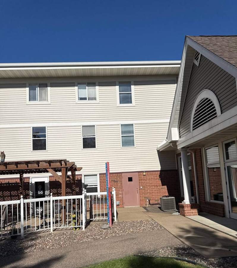 Courtyard side of Oak Meadows Senior Living in Oakdale, MN, where Repair King did siding and roofing work, September 2025