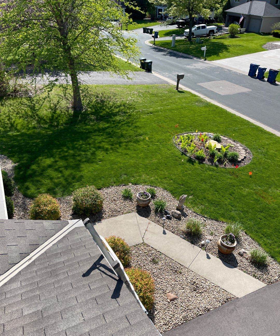 Aerial view of a Rosemount, MN home's roofline and front yard photographed by Repair King during a 2022 roof inspection