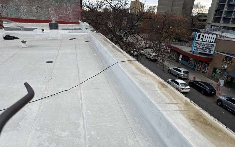 White membrane flat roof of Sagal Restaurant on Cedar Avenue in Minneapolis, with the Cedar Cultural Center marquee across the street