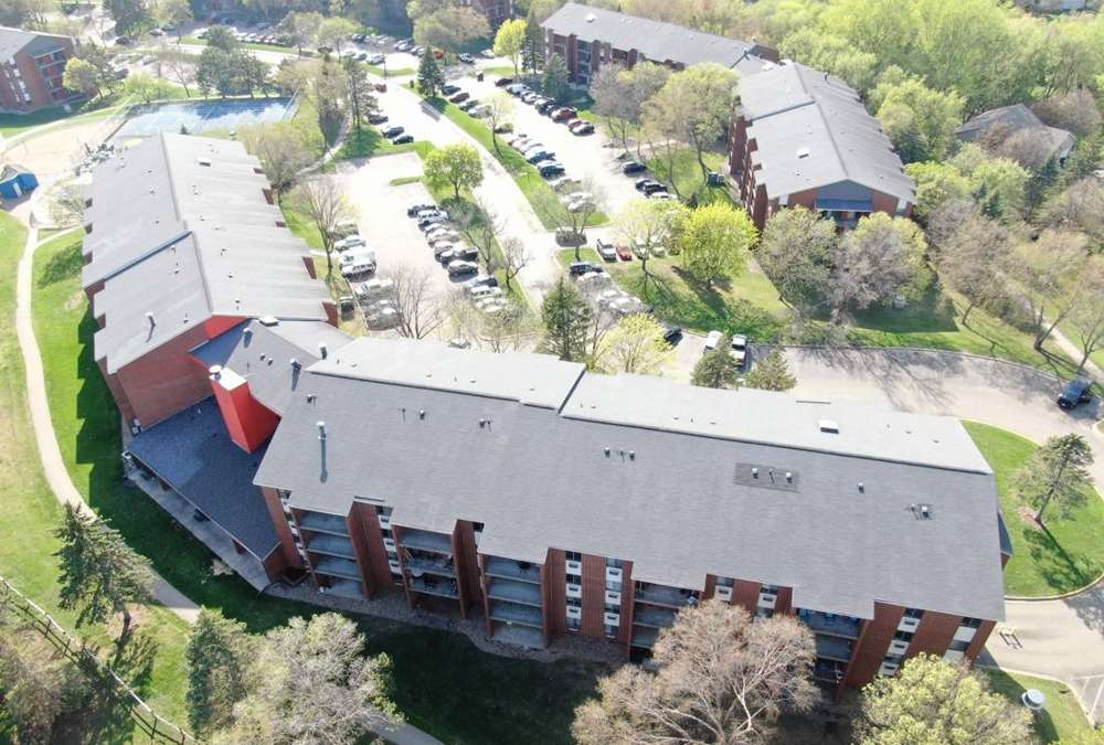 Aerial view of the four-story Twelve 501 apartment buildings in Burnsville, MN, photographed by Repair King in May 2023