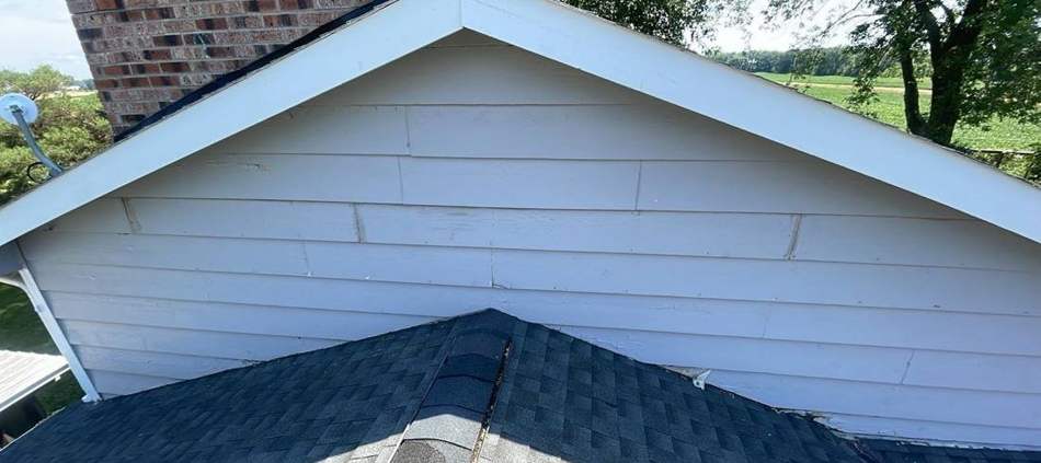 Gable roofline and siding on a Belle Plaine business property inspected by Repair King, August 2023