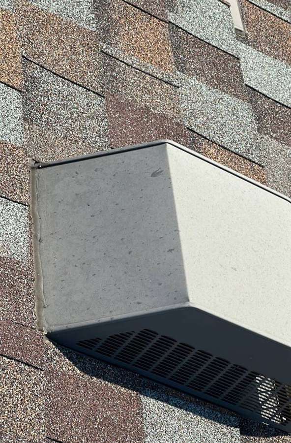 Box vent on a multi-color shingle roof in Annandale, July 2023