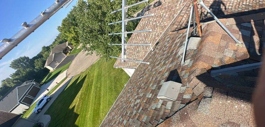 Steep roof valley and vents on an Annandale home, July 2023
