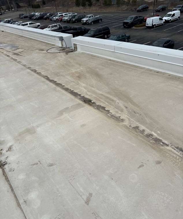 Membrane seams and parapet coping on the FedEx Express Ground station roof on Walnut Street North, Roseville, April 2024