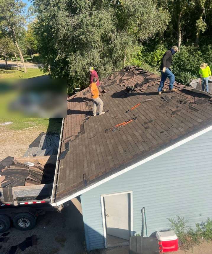 Repair King crew tearing off old shingles on a home on Brooks Lake Road in Cokato, September 2024