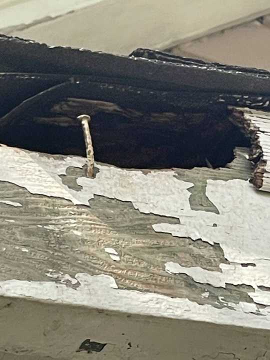 Rotted fascia and peeling paint with a hole at the roof edge of an older New Prague, MN home, photographed by Repair King in August 2021