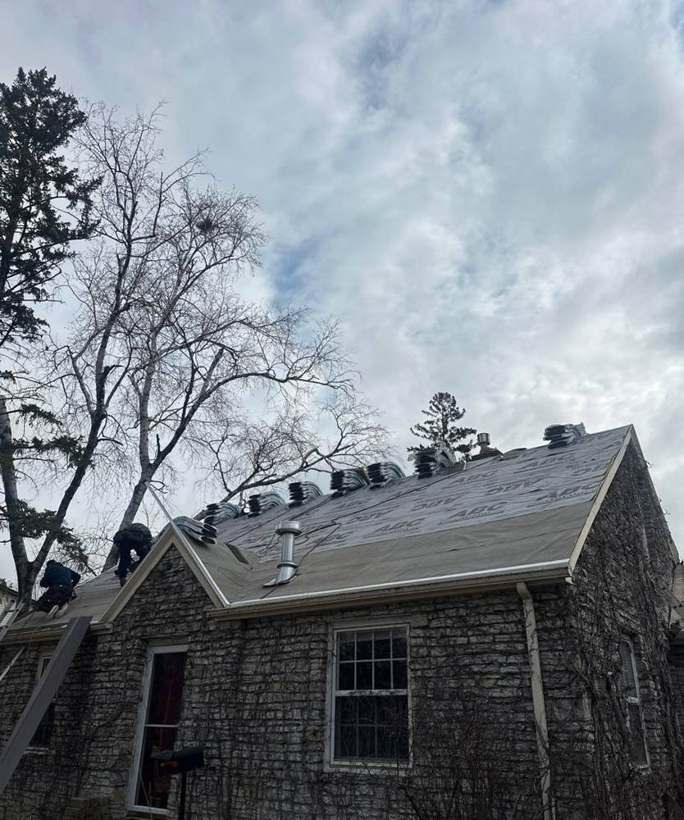 Crew finishing the back slopes of the Richfield story-and-a-half, April 2025