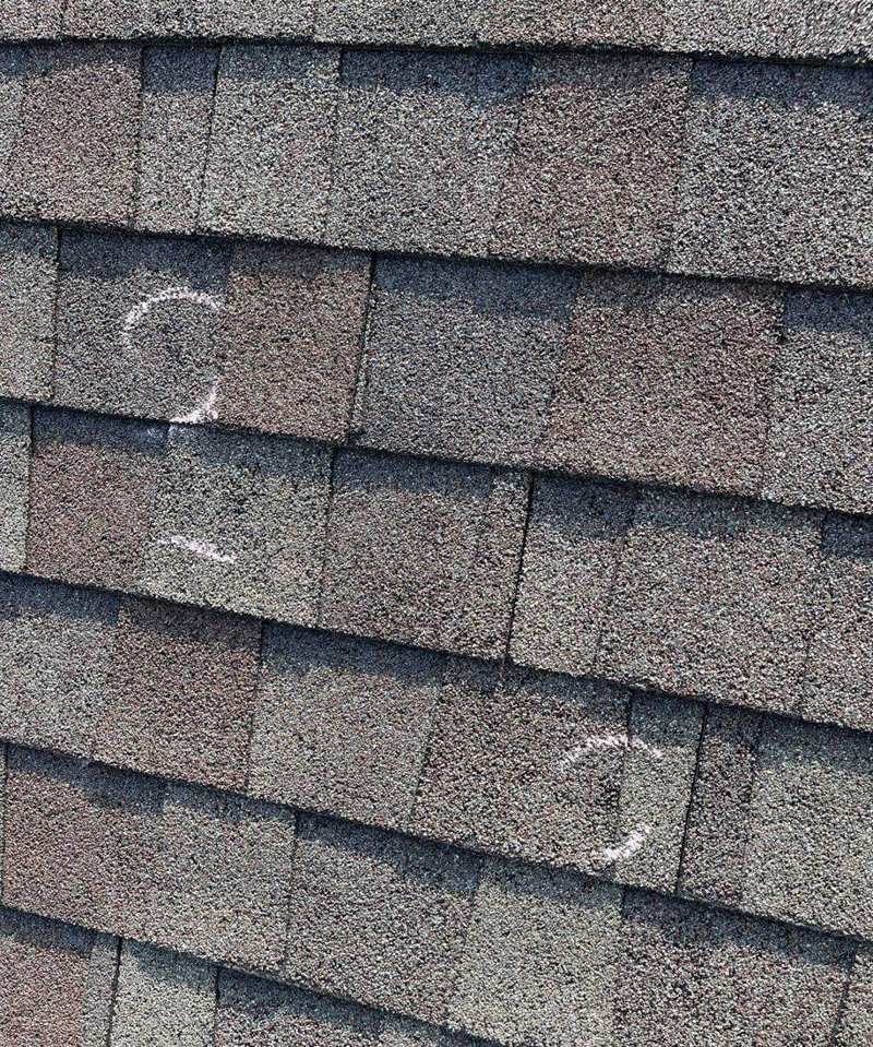 Chalk-marked hail hits on a Zumbrota roof, June 2022