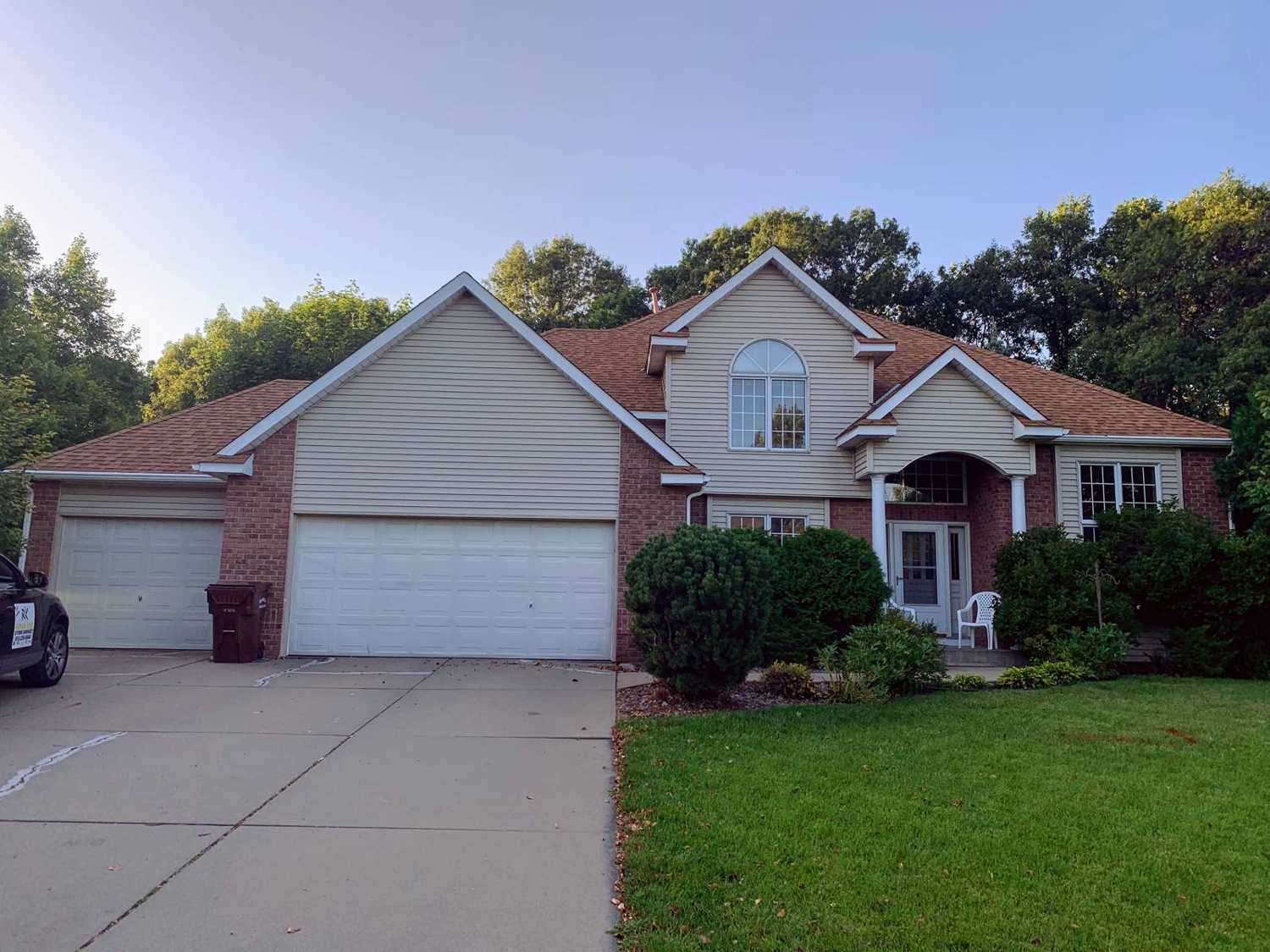 Two-story home with brick and vinyl siding and a three-car garage in Plymouth, MN, photographed by Repair King during an August 2019 storm inspection
