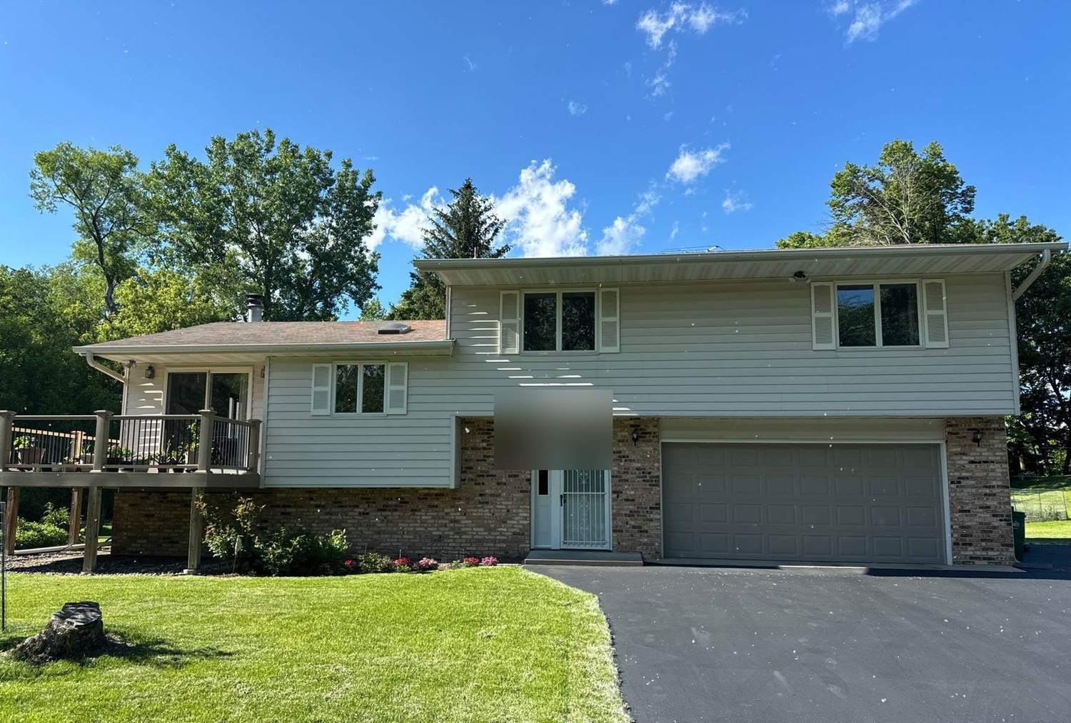 Two-story split-level home in Minnetonka, MN photographed by Repair King during a 2024 roof inspection