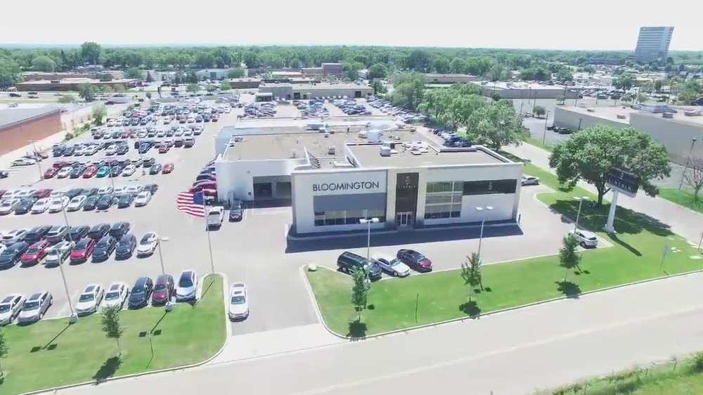 Aerial view of the Bloomington Lincoln dealership at 7800 Dupont Ave S with its flat commercial roof by Repair King