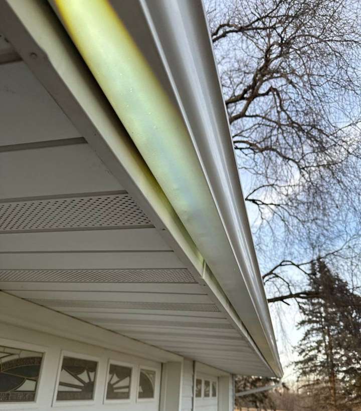 Gutter and soffit along the attached garage of a Little Falls-area farmhouse, January 2024